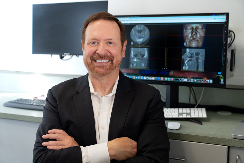 Dr. Kohler with xray screen in background