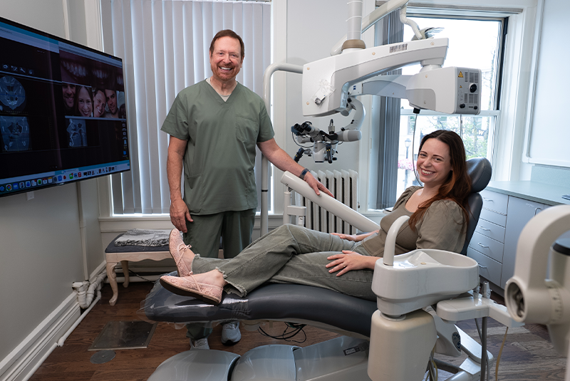 Dr. Craig Kohler with a patient in a dental treatment room