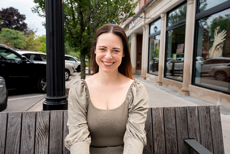 Melissa smiling outside after receiving veneers